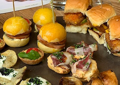 The fund-raiser's menu included a potato chip with sour cream and onion dip and caviar; a mortadella sandwich; a corn, tomato, and Taleggio tart; a spicy cheese biscuit with coppa and tomato jam; and a catfish slider.