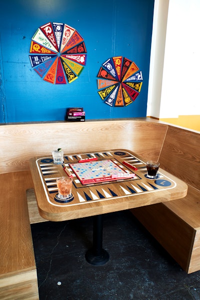 Inside the venue’s “R.E.C. Room” guests can try their hand at axe throwing or play a game of backgammon on the custom tables.