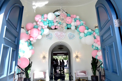 The launch party was held at a private home, where balloons from Wild Child decorated the double spiral staircase at the entrance.