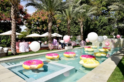 In the backyard, the pool was decorated with additional balloons and doughnut floaties.