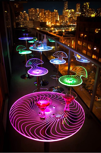 Fort Lauderdale, Florida-based Just Bars’ LED Acrylic Swirl collection includes high-top tables ($100 each) and bar stools ($40 each) in RGB color choices. The rental items can be set to display one color or can rotate through the range of shades. Or for a clear option, simply turn them off. The LED lighting lasts for eight hours, and the bars and tables use a charging system similar to a cell phone.