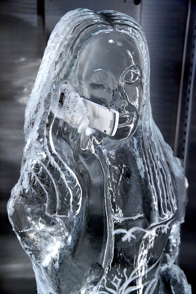 Ice sculptures depicted figures holding 2004's Razr V3 phone.