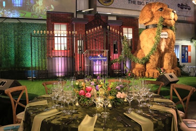Dinner took place within the Samuel Oschin Pavilion, which was transformed to resemble an upscale dog park with 16-foot trees covered in twinkle lights, oversize floral centerpieces, street lights, and green linens. A 10-foot-tall dog, fabricated by florists CJ Matsumoto & Sons, sat on stage. See more: See a Black-Tie Take on a Dog Theme