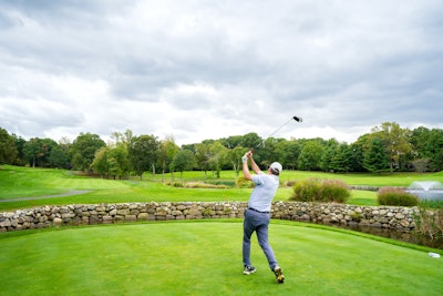 A player tees off during the inaugural Celebrity Chefs & Friends Golf Tournament.