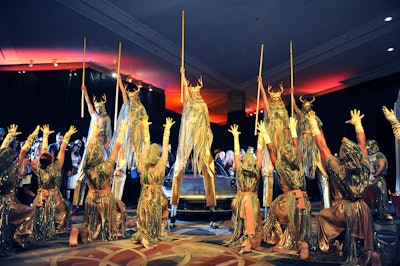 New Century Dance Company presented a “Masterpiece” battle inspired by Game of Thrones. The number included drummers, a master sword fighter, martial artists, stilt walkers, and 20 masked dancers leading the transition from the reception into the main ballroom for dinner.