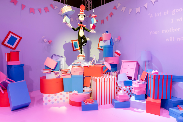 In The Cat in the Hat room, guests can pick up and play with all the objects on the floor. Eventually, as the items are placed into bins, the bins explode, tossing the objects around the room.