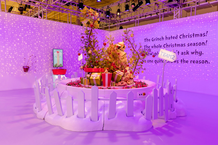 A room inspired by How the Grinch Stole Christmas invites guests to divide into teams and find gifts in the room.