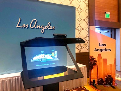 Holograms have come a long way since Tupac Shakur’s post-mortem performance at Coachella. Now, thanks to Vntana, people, products, buildings, and processes can be rendered as holograms in all sizes at events. For example, L.A. Tourism recently used the Van Nuys, California-based company’s plug-and-play kiosk display, called Z Display, to showcase the Los Angeles Convention Center’s expansion at PCMA EduCon. The software renders architectural files as holograms (the image can be updated as the building progresses), processes leads, and uses facial recognition to read the age, gender, and user sentiment. At EduCon, attendees could use hand gestures to reveal information hotspots and to make the hologram spin 360 degrees.