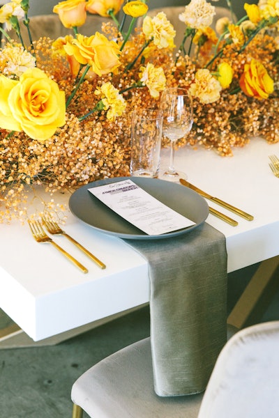 The table design featured eye-catching floral centerpieces from East Olivia in a variety of colors.