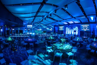 For the Allie Awards in Atlanta in March 2016, themed environments represented earth, water, and fire. Dinner took place in the water-inspired space which had deep blue lighting and blue rentals designed to make guests feel as though they were submerged in ocean waters. Active Production and Design built a custom stage set for the space. See more: 21 Events That Prove Monochromatic Color Schemes Are Anything But Boring