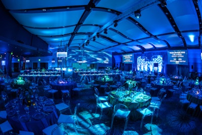 For the Allie Awards in Atlanta in March 2016, themed environments represented earth, water, and fire. Dinner took place in the water-inspired space which had deep blue lighting and blue rentals designed to make guests feel as though they were submerged in ocean waters. Active Production and Design built a custom stage set for the space. See more: 21 Events That Prove Monochromatic Color Schemes Are Anything But Boring