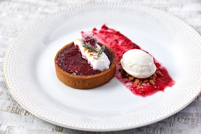 Almond frangipane and cranberries baked in a speculoos spiced pastry, served with ginger gelato, torched meringue, and cranberry caramel, by Abigail Kirsch in New York