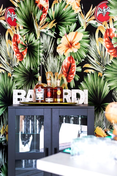 The bright tropical print was studded with the rum brand's bat logo.