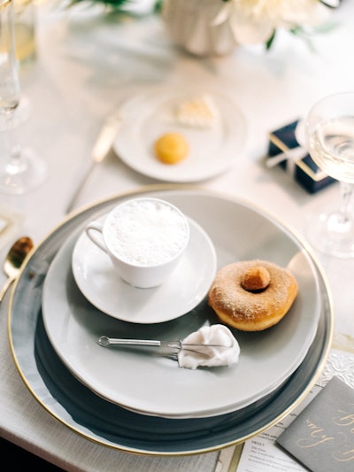 Chai semifreddo garnished with coconut foam and served with a brioche donut with tellicherry peppercorn and cinnamon dust and a whipped coconut whisk, by Truffleberry Market in Chicago