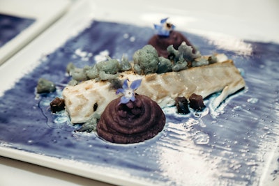 For a sensorial dinner celebrating the launch of the Moroccanoil Color Depositing Mask Collection, chef Bob Spiegel of Pinch Food Design created a branzino dish with blue butterfly tea paint inspired by the hues of the hair products.