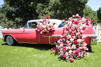 Rosé Day L.A. featured photo-friendly, over-the-top decor like a pink Cadillac covered with roses.
