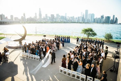 A wedding ceremony on the plaza with the skyline as a backdrop, Photo: Kristin La Voie Photography