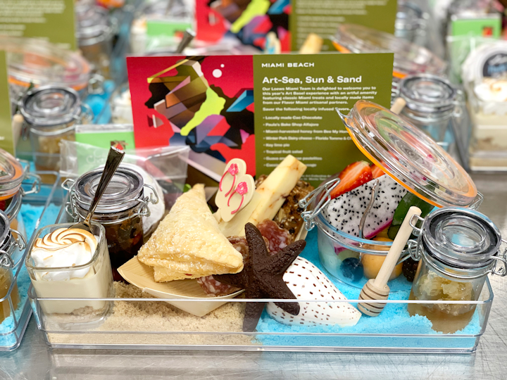 Loews Miami Beach Hotel provided &ldquo;Art-Sea, Sun &amp; Sand&rdquo;-theme welcome amenities to guests. The array featured snacks, chocolates, charcuterie, and cheeses from Miami vendors, along with house-made treats including key lime pie, tropical fruit salad, and guava and cheese pastelitos.