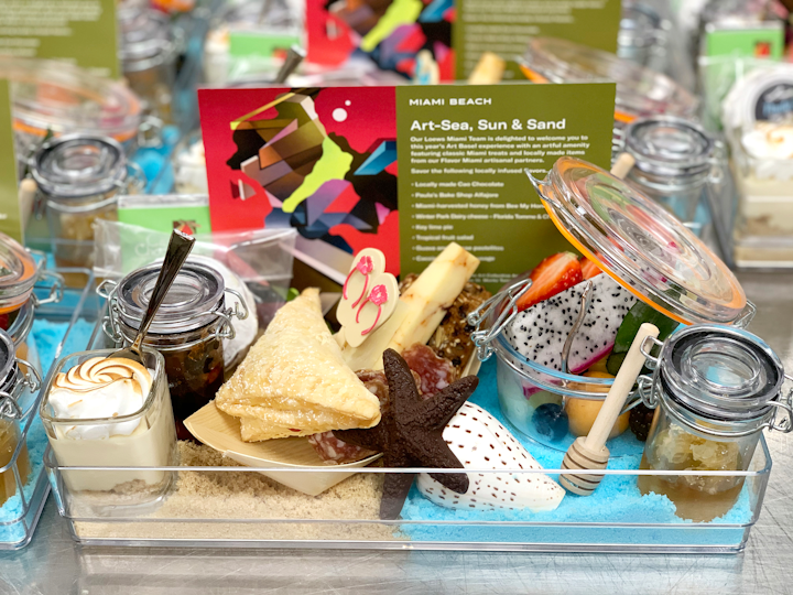 Loews Miami Beach Hotel provided “Art-Sea, Sun & Sand”-theme welcome amenities to guests. The array featured snacks, chocolates, charcuterie, and cheeses from Miami vendors, along with house-made treats including key lime pie, tropical fruit salad, and guava and cheese pastelitos.