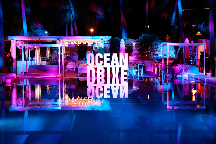 Logo signage reflecting off the pool from Ocean Drive&rsquo;s Art of the Party event that kicked off the Delano&rsquo;s festivities on December 3.