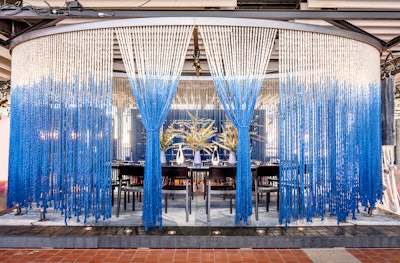 For Diffa’s annual Dining by Design fund-raising event, which took place in March 2018 at Pier 92 in New York, Rockwell Group partnered with the Rug Company to create an elliptical curtain made of 400 strands of hand-dyed, blue ombre carpet fibers, showcasing the Lola rug designed by David Rockwell and his daughter Lola. See more: 23 Inventive, Thought-Provoking Dining and Tabletop Ideas