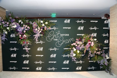 The florals and greenery continued to the event’s step-and-repeat.