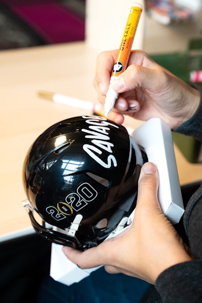 On the second day, guests received a surprise in their lockers: mini helmets that could be personalized with team logos, phrases, and names.