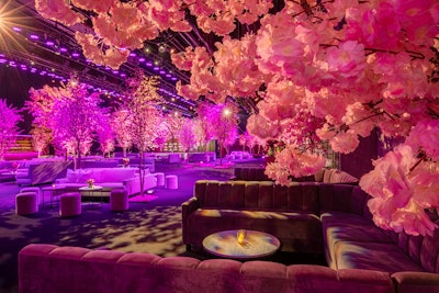 This year's event had a 'cherry blossom forest' theme from producers Event Eleven. Trees featuring various shades of pink blossoms were stationed alongside plush furniture, walnut details, and pops of pink.