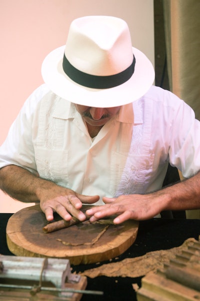 As a nod to Cuba’s influence on the Art Deco era, cigar rolling by Castaneda Cigars took place on site.