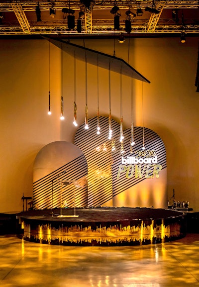 Billboard celebrated its annual Power 100 list, which honors the music industry’s top executives, during Grammys week. Shiraz Creative handled event design and production, while Stoelt Productions handled fabrication, rigging, and permitting. Hanging lights, gold tones, and reflective surfaces added an appropriately celebratory touch.