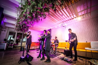 For a client event, First transformed its café space into a performance area for a live band.