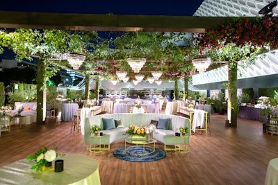 The Emmys party for Disney’s networks—ABC, Disney Television Studios, FX Networks, Hulu, and National Geographic—was designed and produced by Sterling Engagements. Decor was inspired by the last day of summer and filled with lush greenery, citrus trees, and bright florals. Overhead greenery was accented by a series of crystal chandeliers from Amber Event Production.