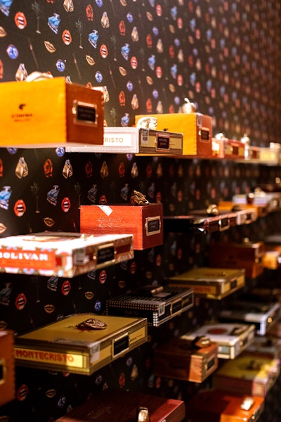 A wall of cigar boxes served as a unique seating chart.