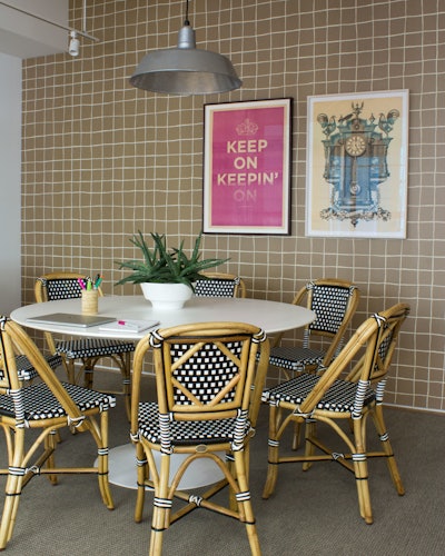 David Stark's Brooklyn headquarters has a stylish grid motif, which uses Kelly Wearstler wallpaper and Quaderna tables.