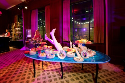 Guests headed to the venue’s third floor for the after-party, which was designed to feel a bit more modern with bold colors and furniture from Italian artist Maurizio Cattelan. The dessert table continued the surreal theme.