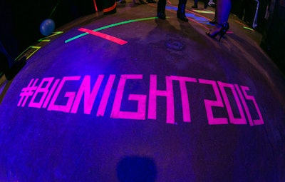 Big Brothers Big Sisters of Massachusetts Bay hosted its annual 'Big Night' fund-raiser in February 2015. The event's hashtag was spelled out in glowing neon tape on the floor, tying into the gala’s 1990s theme. See more: See a Benefit That Took Guests Back to the '90s