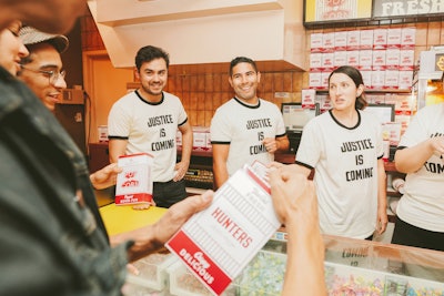 Inside the screening, popcorn and other snacks were served in branded, vintage packaging. Staffers wore T-shirts with one of the show's taglines.