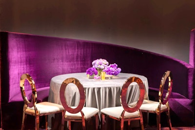 Linens from Resource One complemented the ceiling decor, using 2,000 yards of shimmering fabrics in amethyst and champagne colors, plus eggplant sequins, copper satins, linear stripes, and soft gray velvet. The fabrics were custom-made for the Governors Ball and took six weeks to manufacture. Form Decor, Hire Elegance, and Blueprint Studios provided the furniture, while ShowPro handled audiovisual production.
