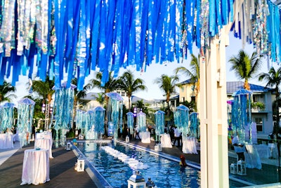 The welcome party featured oversize jellyfish decor over the pool. At night, they were lighted for an ethereal vibe. Gifts for the Good Life left the items at the resort for reuse at future events.