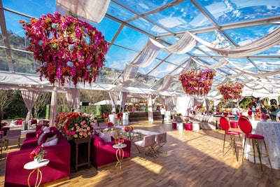 Roc Nation’s annual Grammys brunch had three oversize floral chandeliers with flowers from Celio’s Design along with white draping.