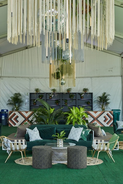 Revel Decor brought out all the green stops (and metallic accents) for the 2019 Chicago Summer Festival. 'Choosing a variety of coordinating shades makes a color scheme more exciting,' said Revel Decor event producer Marissa Moore. 'Incorporating pieces that lean more blue or yellow make greens pop. Playing with wood tones, neutral material, and fresh foliages add that additional layer of texture the space needs.'