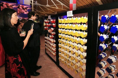 The color-blocking continued through the space, including color-coded food stations such as a 'noodle wall' made from Chinese takeout boxes. The boxes were filled with a noodle salad from Good Gracious! Catering.