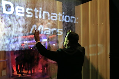 As in previous years, dinner took place in the Samuel Oschin Pavilion underneath the space shuttle Endeavour. Guests entered by walking through a wall of fog from Event Special Effects, which was projected with a countdown sequence as they entered the space.