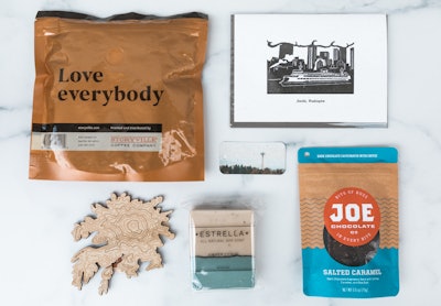 Keep Your City Smiling sells gift boxes that benefit struggling local businesses. The boxes include goods such as chocolate, art cards, craft coffee, candles, mugs, and lotions.