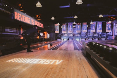 After the screening, fans headed across the street to Highland Park Bowl, now known as 'Hunters Alley.' The popular bowling alley—the oldest in Los Angeles—was transformed with branded bowling balls and signage, New York City-inspired food such as pizza and latkes, Coney Island-style performers, on-theme photo ops, and staffers in period costumes. See more: Amazon's Gritty 'Hunters' Promotion Turned an Entire City Block into 1970s New York