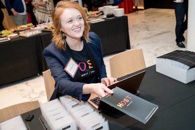 At registration, guests received their nametag and a printed pamphlet with the day's schedule and speaker roster. On the name badges, if a guest had been a speaker on the podcast, the episode number in which they were featured was printed on the badge.