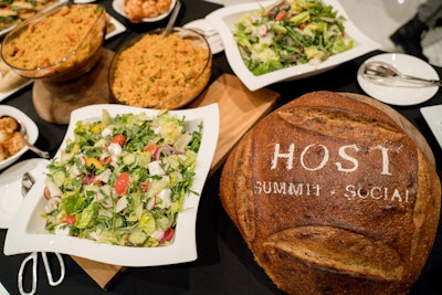 During the networking luncheon, Breads Bakery offered a healthy spread for conference-goers—including a freshly baked bread loaf boasting the event's logo.