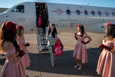 Fans—and flight attendants—dressed in 1960s-style outfits. Once they landed in Las Vegas, the group stayed overnight at the ultra-luxe Cosmopolitan hotel.