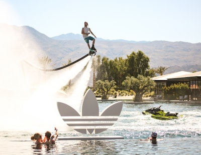 In 2019, Adidas hosted its annual Sports Club at the Zenyara Estate in Coachella Valley. Intended as an intersection of sports and culture, the club hosted a variety of events over both weekends, including a cell-phone-free mini festival and a music-focused brunch. There was also synchronized swimming and water jetpack acrobatics. The Corso Agency handled production for the events, with assistance from Clear As Day. See more: Coachella 2019: See Inside the Biggest Parties and Brand Activations