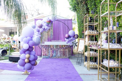 The pretty-in-purple event had a 'moody celestial meets summer solstice design,' according to Rembac.